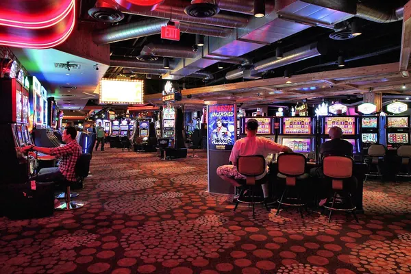 Closed casino doors with a stop sign